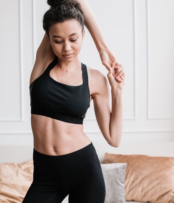 Athlete in a focused yoga pose, stretching deeply.